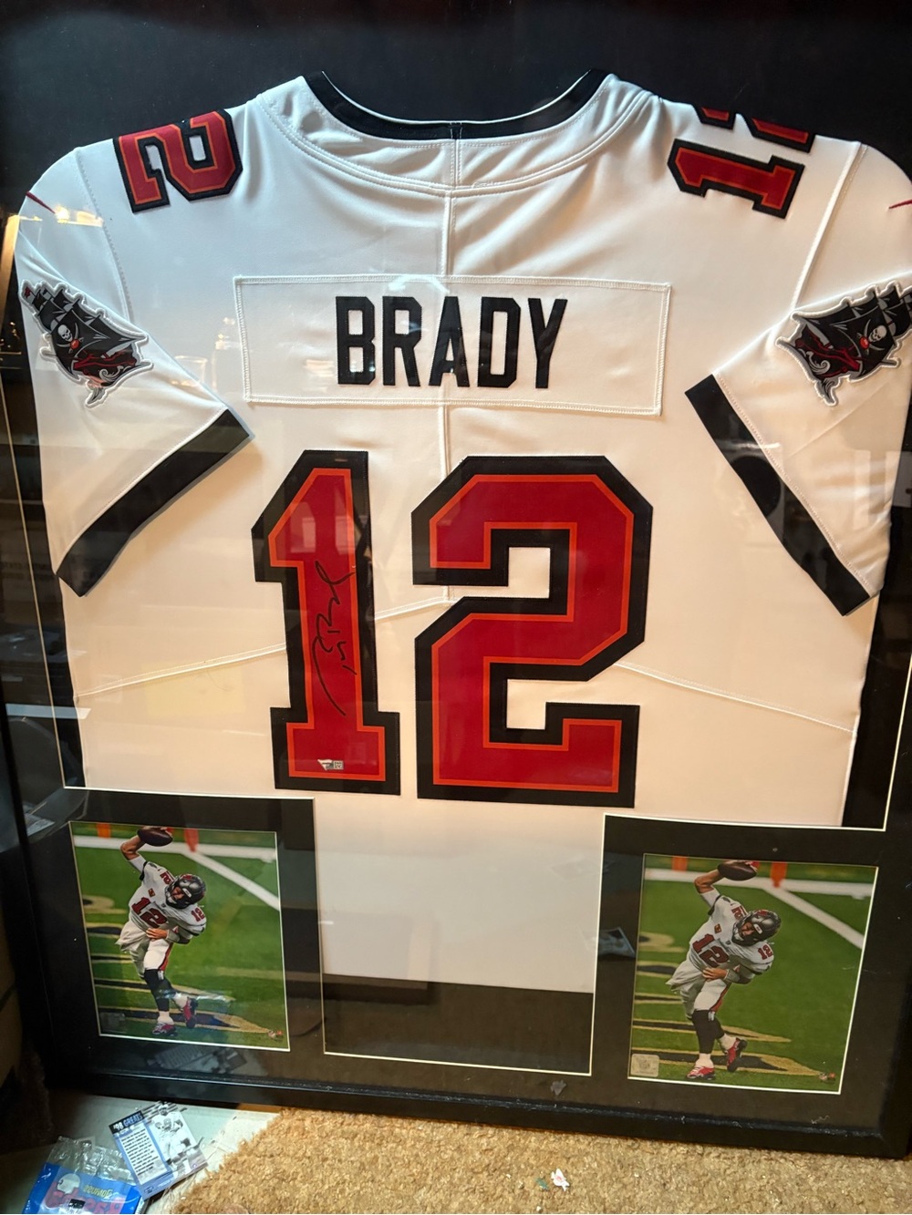 Framed Tom Brady home Tampa bay autographed jersey.